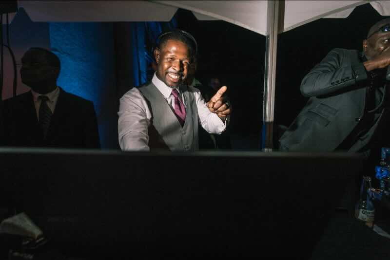 DJ Lenard posing for a photo